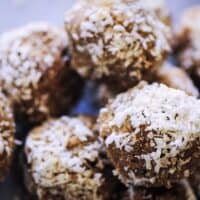a close up of a mound of coconut bliss balls