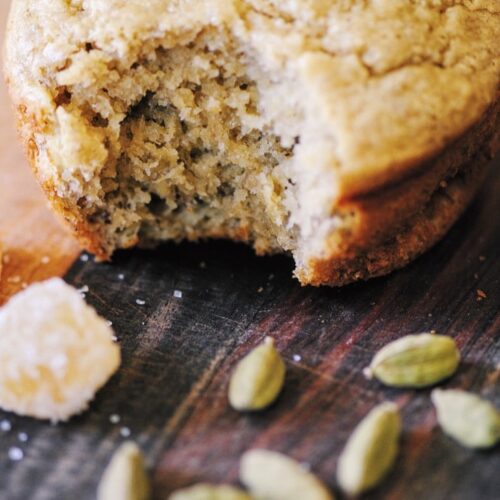 Gluten-Free Banana Muffins with Ginger and Cardamom 7 a close up shot of a bite taken out of a gluten free banana muffin