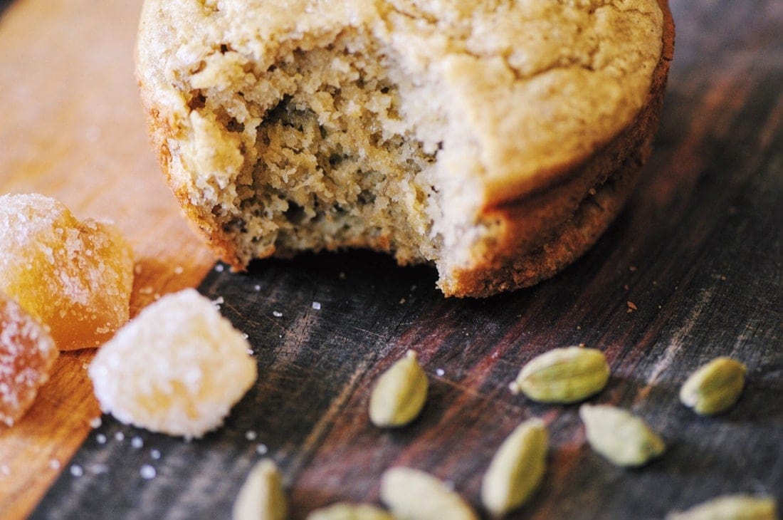 a close up shot of a bite taken out of a gluten free banana muffin
