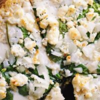 brown rice pizza crust topped with cheese and spinach