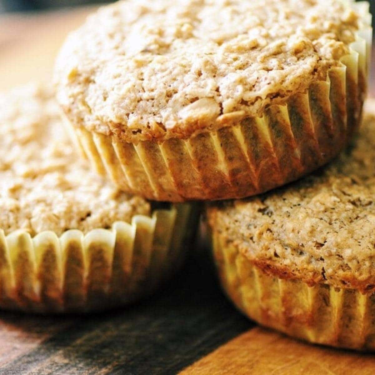 a stack of white muffins with muffin liners.