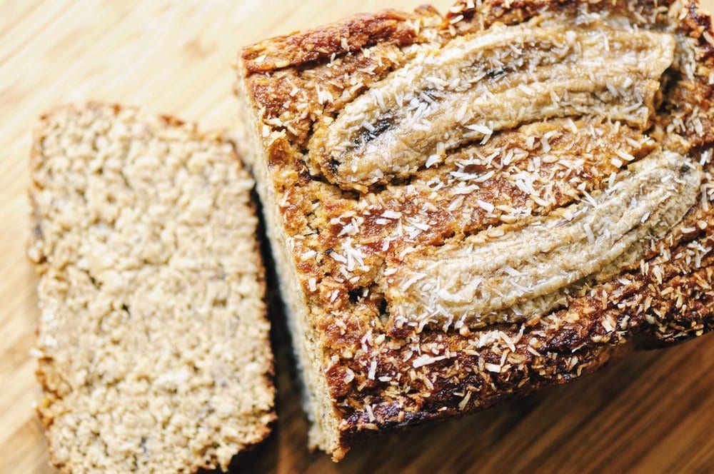  This Gluten-Free Coconut Banana Bread makes for one luscious and hearty loaf perfect for breakfast, a snack or a healthy treat! #glutenfreebread #coconutbananabread #bananabread #coconut #healthy #highprotein #baking 