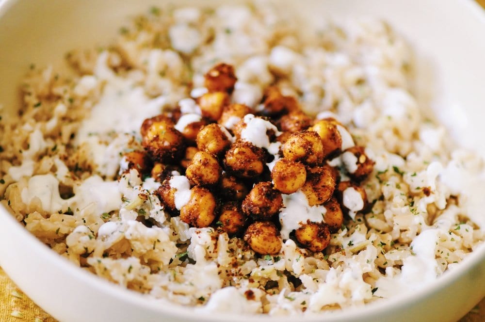  This Coconut Ginger Rice Bowl with Spicy Turkish Roasted Chickpeas and a drizzle of Garlic Yogurt sauce makes for one super delicious, healthy, and filling gluten-free vegan lunch or dinner! #rice #lunch #dinner #healthy #coconut #ginger #spicy #turkish #chickpeas #garlic #yogurt #sauce #roasted #glutenfree #vegan #meal 