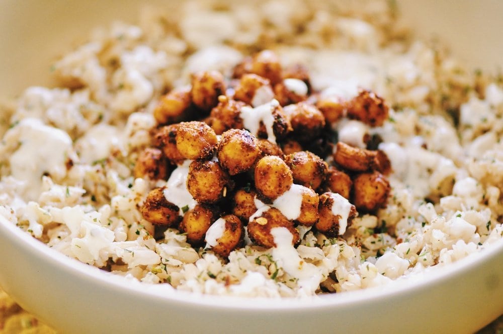  This Coconut Ginger Rice Bowl with Spicy Turkish Roasted Chickpeas and a drizzle of Garlic Yogurt sauce makes for one super delicious, healthy, and filling gluten-free vegan lunch or dinner! #rice #lunch #dinner #healthy #coconut #ginger #spicy #turkish #chickpeas #garlic #yogurt #sauce #roasted #glutenfree #vegan #meal 