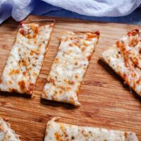 quinoa pizza crust on cutting board