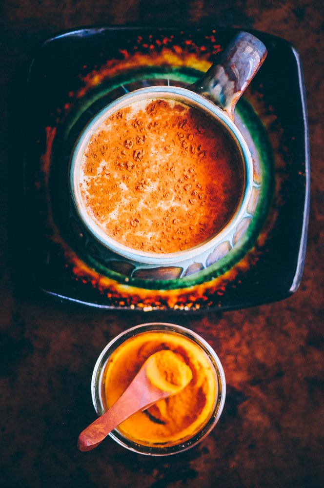  A soothing and healing spicy golden milk (turmeric tea) with amazing health benefits! Vegan & gluten-free. #goldenmilk #spiced #spicy #spicygoldenmilk #turmeric #turmerictea #drink #beverage #healthy #ayurveda #antiinflammatory #vegan 