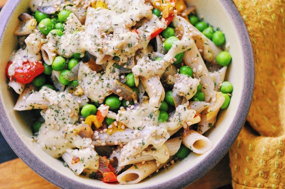  This hearty, filling, healthy and delicious Spicy Veggie Confetti Pasta Bowl topped with Peanut Sauce makes for one beautiful and vibrant Gluten-Free & Vegan lunch or dinner! #pasta #noodlebowl #spicy #veggie #confetti #peanutsauce #glutenfree #vegan #rainbowbowl #lunch #dinner #healthy #easy 