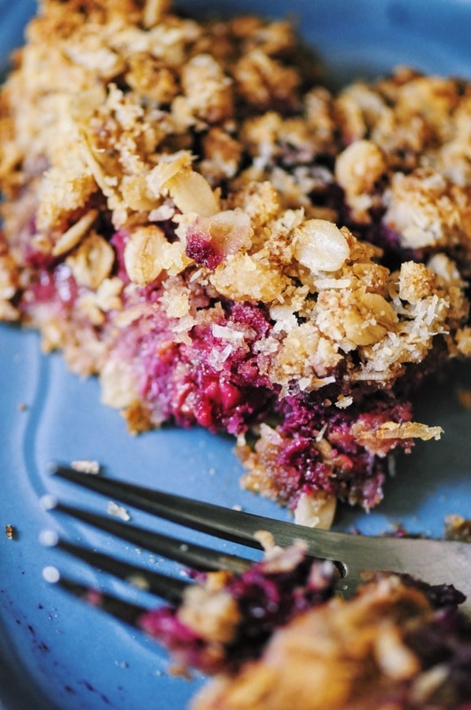  A luscious triple berry filling atop a crisp crust & topped with a delightful coconut crumble makes for one easy, healthy and delicious gluten-free and vegan dessert! #berrycrumble #vegan #glutenfree #coconut #oat #almondcrust #healthydessert #refinedsugarfree 