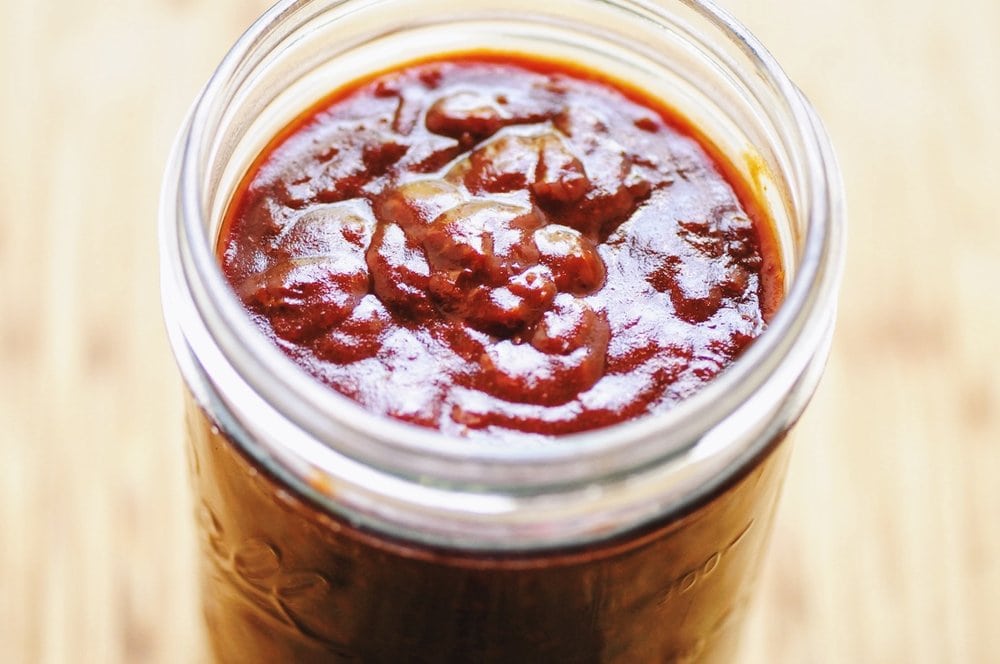  This New Mexican Style Red Chile Enchilada Sauce will become a kitchen staple in no time. This flavorful and healthy sauce is gluten-free, vegan and makes a great accompaniment to your favorite Mexican dishes! #newmexicanchile #redchile #enchiladasauce #mexicanfood #vegan #veganenchiladasauce 