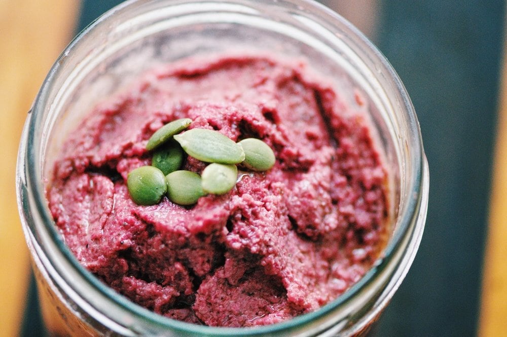  This thick, creamy, and delicious Beet and Pumpkin Seed Pesto is an absolute savory delight! Its versatility will have you putting it on anything & everything; and its amazing flavor will have you coming back for more again & again! #beetpesto #pumpkinseedpesto #beetroot #pumpkin #pesto #pink #glutenfree 