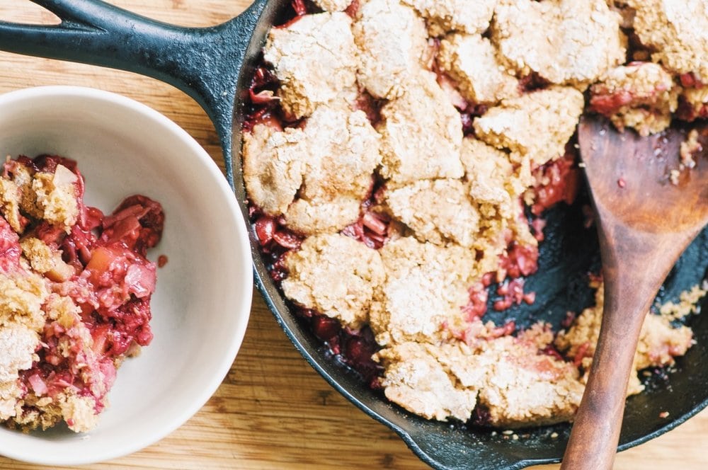 A cast iron skillet filled with gluten free apple cobbler.