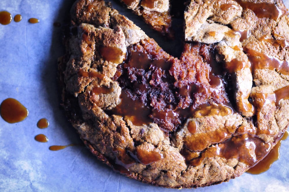  An intoxicatingly spiced apple and butternut squash filling enveloped in a gluten-free chai tea infused buckwheat crust drizzled with a delectable coconut caramel drizzle. This rustic pie makes for the perfect autumn dessert! #glutenfreegalette #applegalette #butternutsquashgalette #chaipie #buckwheatpiecrust #coconutcaramel #glutenfreepie #dessert #autumn 