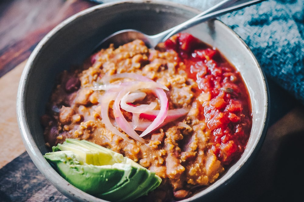  This Instant Pot Millet and Pinto Bean Chili makes for one super flavorful, healthy, protein-packed and easy to make gluten-free vegan meal! #instantpotchili #milletchili #pintobeanchili #veganchili #pressurecookerchili #vegetarianchili 