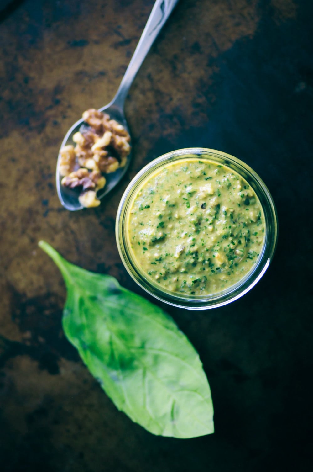  This amazingly creamy and delicious Cheesy Vegan Walnut Pesto is made from a blend of basil, spinach, kale, garlic, walnuts, and nutritional yeast! It is vegan, gluten-free, healthy, vibrant and ridiculously tasty. It makes for one perfect green condiment ready to use on just about any savory dish! #veganpesto #walnutpesto #cheesyveganpesto #easypesto 