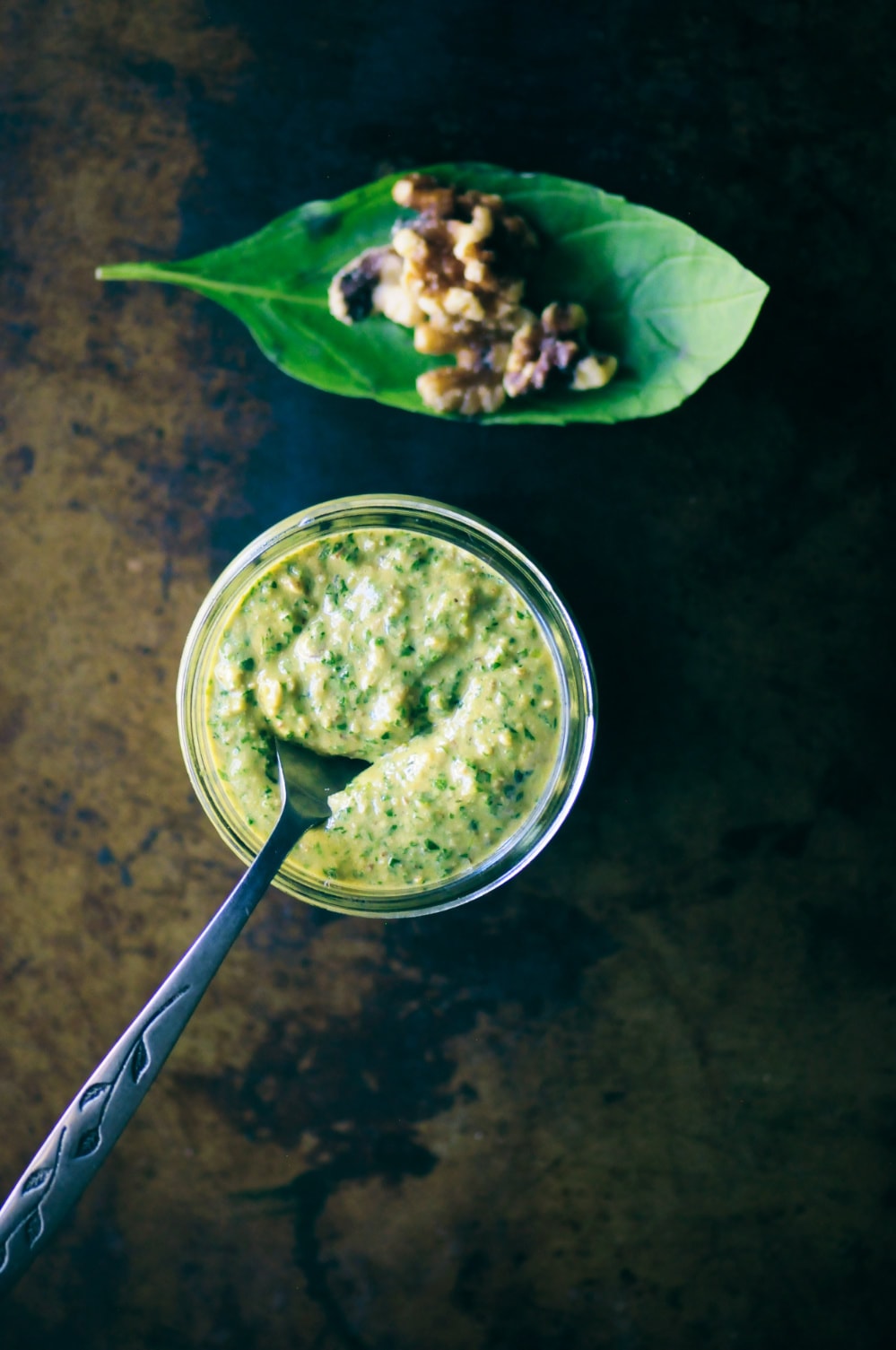  This amazingly creamy and delicious Cheesy Vegan Walnut Pesto is made from a blend of basil, spinach, kale, garlic, walnuts, and nutritional yeast! It is vegan, gluten-free, healthy, vibrant and ridiculously tasty. It makes for one perfect green condiment ready to use on just about any savory dish! #veganpesto #walnutpesto #cheesyveganpesto #easypesto 