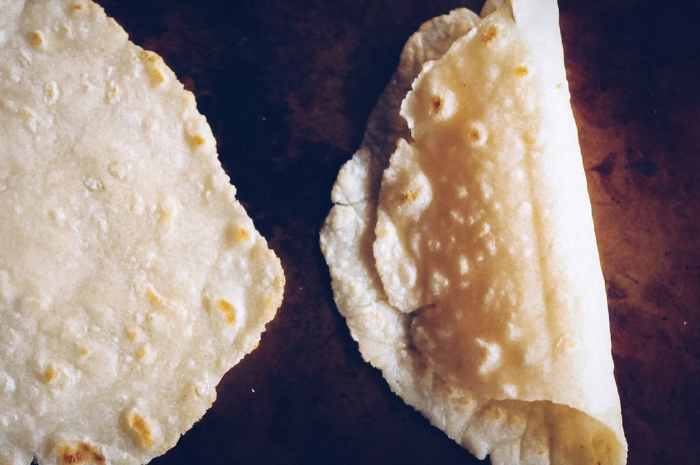  The Best Gluten-Free & Vegan Tortillas that make the perfect pliable and foldable wraps ready for your favorite fillings or served alongside your favorite Mexican meals! They only take 4 ingredients, are super simple and easy to make, and absolutely delicious! #glutenfreetortillas #glutenfreewraps #thebestglutenfreetortillas #easytortillas #vegantortillas #veganwrap #glutenfreemexican 