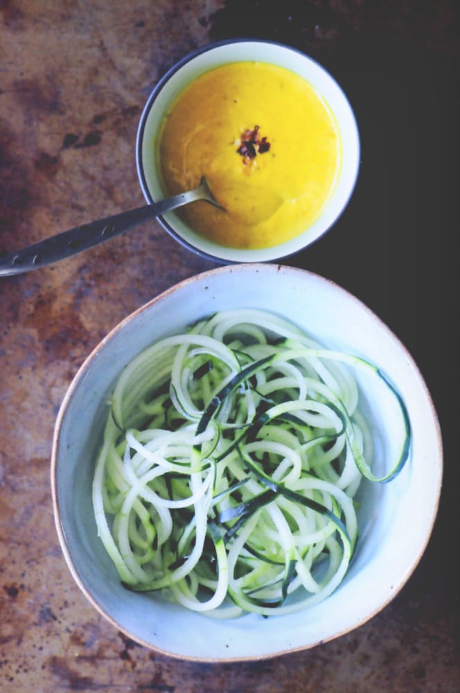  A refreshing, light, healthy and easy spiralized cucumber noodle dish served alongside a spicy turmeric tahini sauce and garnished with bell pepper for a delightful crunch. Gluten-free, vegan, and oh so delicious! #spiralizedcucumber #cucumbernoodles #turmerictahinisauce #spicycucumbernoodles #zoodles 