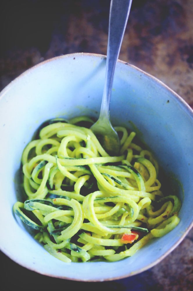  A refreshing, light, healthy and easy spiralized cucumber noodle dish served alongside a spicy turmeric tahini sauce and garnished with bell pepper for a delightful crunch. Gluten-free, vegan, and oh so delicious! #spiralizedcucumber #cucumbernoodles #turmerictahinisauce #spicycucumbernoodles #zoodles 