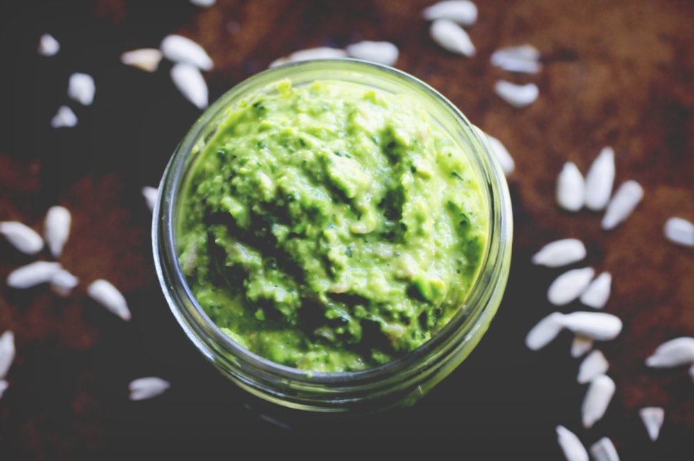  A gluten-free and vegan Sunny Spring Pea & Basil Pesto made with spring peas, fresh basil, mixed greens, sunflower seeds, garlic, and lemon juice. This delicious pesto is easy, healthy, and DELICIOUS! #veganpesto #springpesto #peapesto #basilpesto #sunflowerseedpesto 