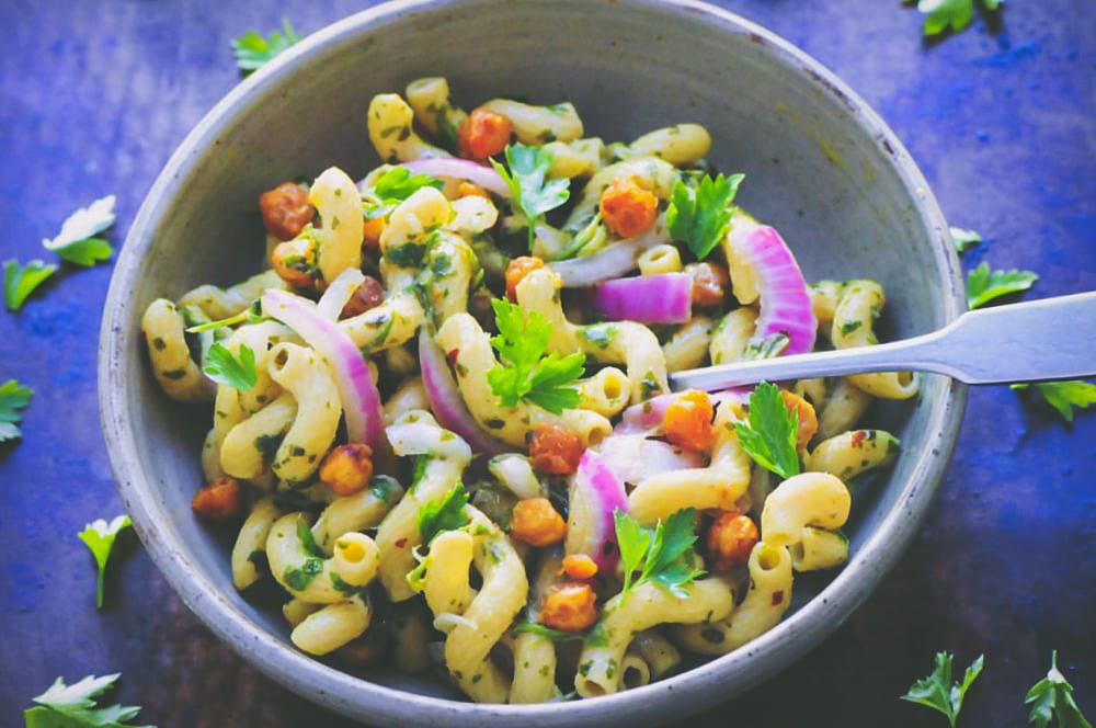  This Spicy Chimichurri Chickpea Pasta Bowl is super flavorful, healthy, easy to make, gluten- free, vegan, and packed with protein and fiber! #chimichurripasta #spicypastasalad #glutenfreepasta #veganpastasalad #chickpeapasta 