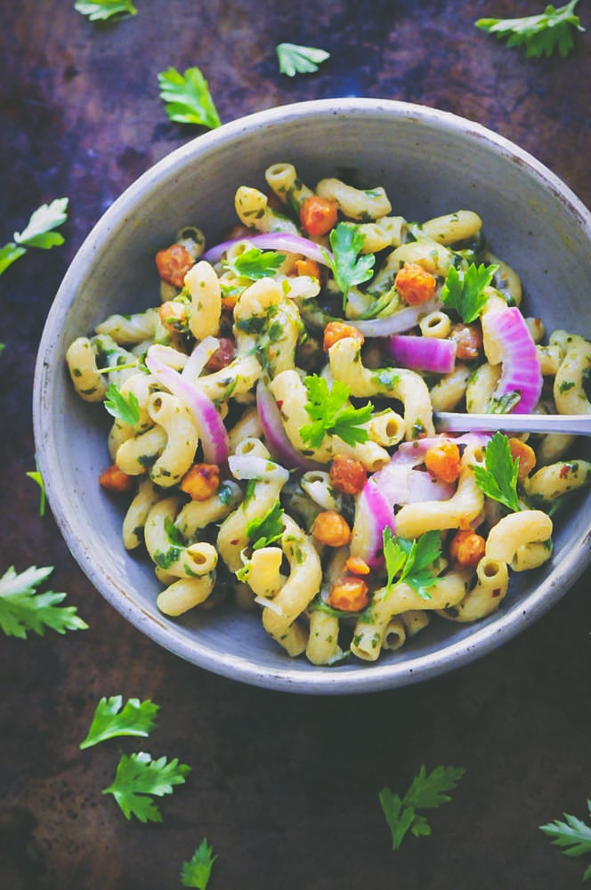  This Spicy Chimichurri Chickpea Pasta Bowl is super flavorful, healthy, easy to make, gluten- free, vegan, and packed with protein and fiber! #chimichurripasta #spicypastasalad #glutenfreepasta #veganpastasalad #chickpeapasta 