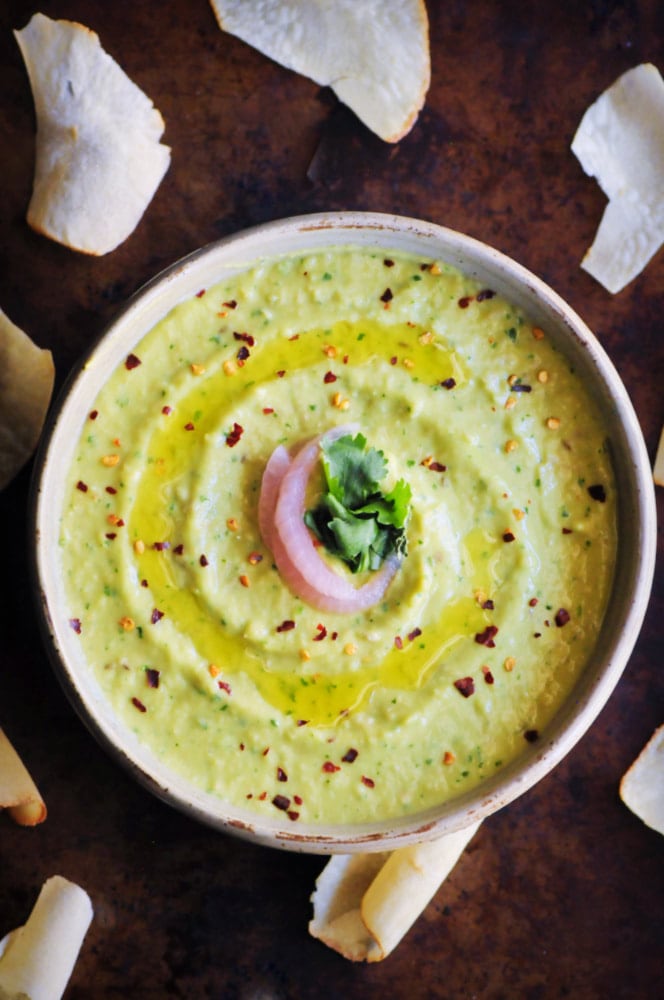  An ultra creamy, healthy, and delicious Spicy Cilantro Avocado Hummus that is vegan, gluten-free, and super quick and easy to make! #spicyhummus #avocadohummus #cilantrohummus #cilantroavocadohummus #spicydip 