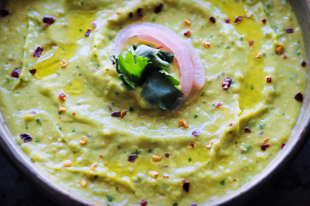  An ultra creamy, healthy, and delicious Spicy Cilantro Avocado Hummus that is vegan, gluten-free, and super quick and easy to make! #spicyhummus #avocadohummus #cilantrohummus #cilantroavocadohummus #spicydip 