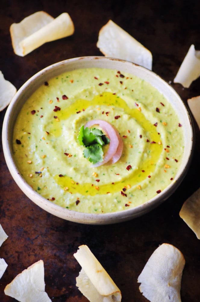  An ultra creamy, healthy, and delicious Spicy Cilantro Avocado Hummus that is vegan, gluten-free, and super quick and easy to make! #spicyhummus #avocadohummus #cilantrohummus #cilantroavocadohummus #spicydip 