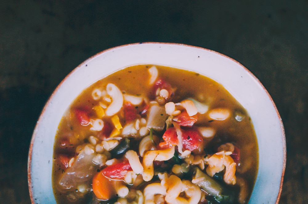  This high-protein Gluten-Free and Vegan Lentil Minestrone Soup is packed with hearty, healthy, and delicious ingredients and can be ready on the table in under 30 minutes! #glutenfreeveganminestrone #glutenfreevegansoup #glutenfreeminestronesoup #veganminestrone #lentilminestrone #lentilsoup 