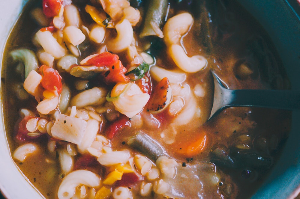  This high-protein Gluten-Free and Vegan Lentil Minestrone Soup is packed with hearty, healthy, and delicious ingredients and can be ready on the table in under 30 minutes! #glutenfreeveganminestrone #glutenfreevegansoup #glutenfreeminestronesoup #veganminestrone #lentilminestrone #lentilsoup 