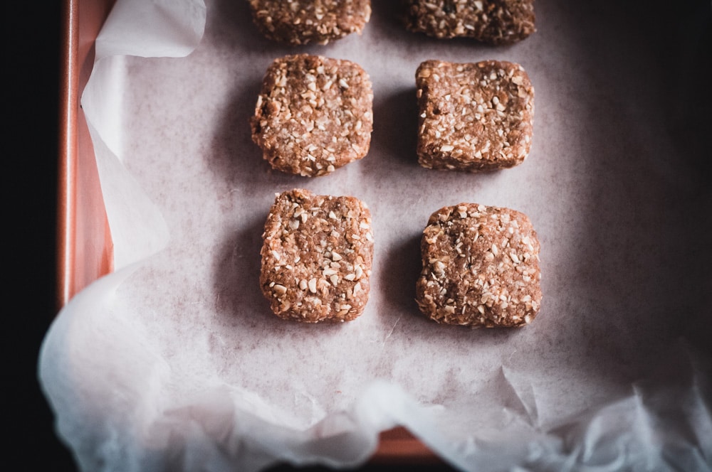  These gluten-free and vegan No Bake Super Seed Cinnamon Maca Energy Squares are filled with energy boosting and hormone balancing properties; as well as being high in protein, iron, calcium, B vitamins, selenium, folate, fiber, omega-3’s and vitamin E. They make for one flavorful and nourishing healthy treat that is easy to make, too! #nobakebars #macabars #energybars #veganbars #seedbars #glutenfreebars #hormonebalancing 