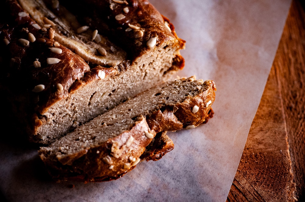  This Gluten-Free Sunflower Butter Bread with bananas, could not be more simple to make! You only need one bowl and 3 ingredients to create a delicious and healthy gluten-free, dairy-free, grain-free bread that slices well and tastes positively delicious! #sunbutter #sunbutterbread #sunflowerseedbutter #flourlessbread #glutenfreebananabread #bananabread #sugarfreebananabread #sunflowerbutter 