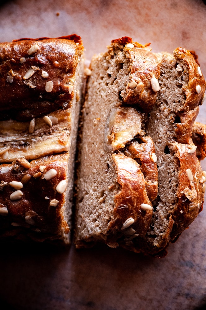  This Gluten-Free Sunflower Butter Bread with bananas, could not be more simple to make! You only need one bowl and 3 ingredients to create a delicious and healthy gluten-free, dairy-free, grain-free bread that slices well and tastes positively delicious! #sunbutter #sunbutterbread #sunflowerseedbutter #flourlessbread #glutenfreebananabread #bananabread #sugarfreebananabread #sunflowerbutter 