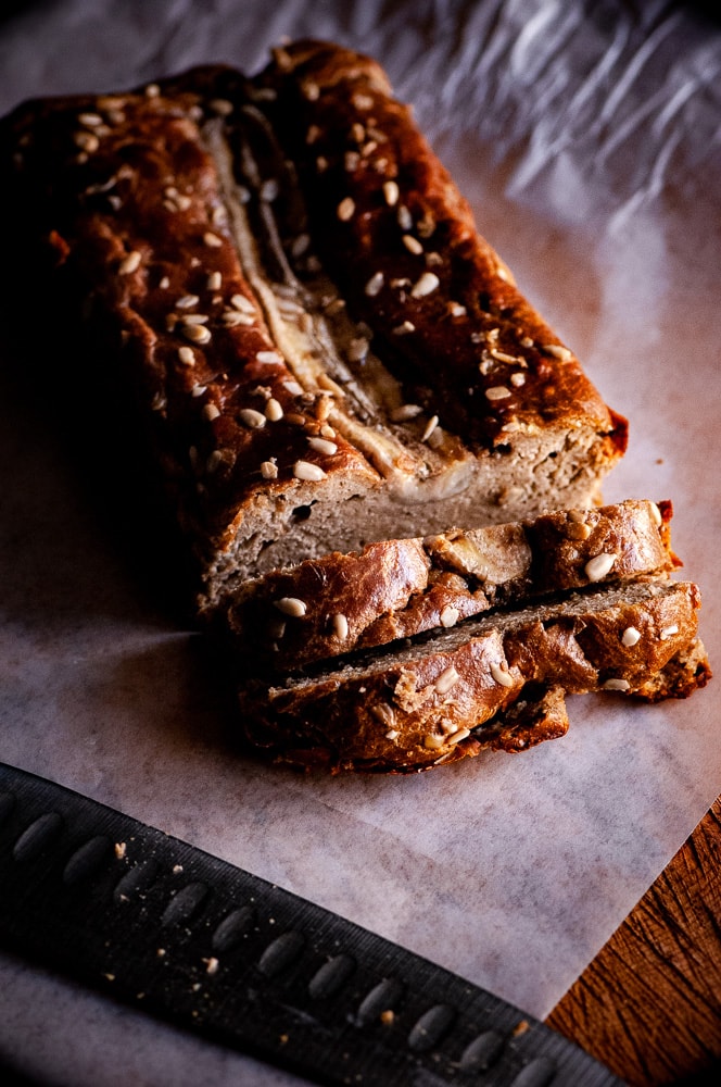  This Gluten-Free Sunflower Butter Bread with bananas, could not be more simple to make! You only need one bowl and 3 ingredients to create a delicious and healthy gluten-free, dairy-free, grain-free bread that slices well and tastes positively delicious! #sunbutter #sunbutterbread #sunflowerseedbutter #flourlessbread #glutenfreebananabread #bananabread #sugarfreebananabread #sunflowerbutter 