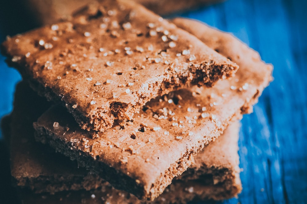  Easy, healthy, and DELICIOUS Gluten-Free Graham Crackers that are also vegan, dairy-free, egg free, soy-free, nut-free and refined sugar-free. This healthy graham cracker recipe is super EASY and certain to please kids and adults alike! #grahamcrackers #glutenfreegrahamcrackers #vegangrahamcrackers #sugarfreegrahamcrackers #glutenfreecheesecake 