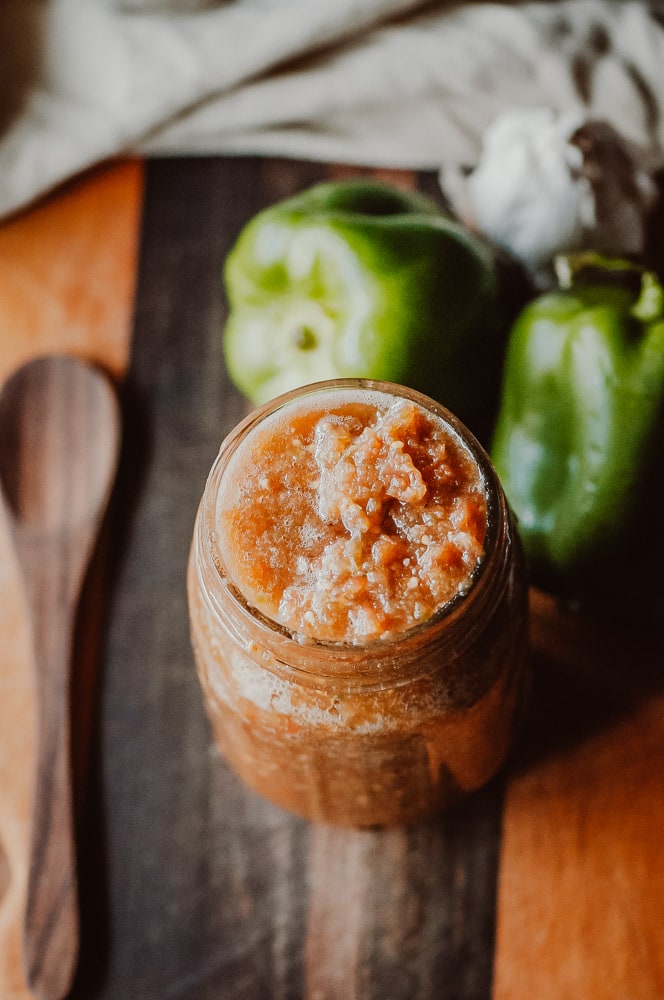  Super EASY + DELICIOUS fermented salsa made with bell peppers, cherry tomatoes, garlic and spices. This vegan homemade spicy salsa is filled with probiotics and gut healing properties and filled with fizzy, rich deliciousness perfect for topping Mexican dishes! #fermentedsalsa #spicysalsa #bellpeppersalsa #homemadesalsarecipe #easysalsarecipe 