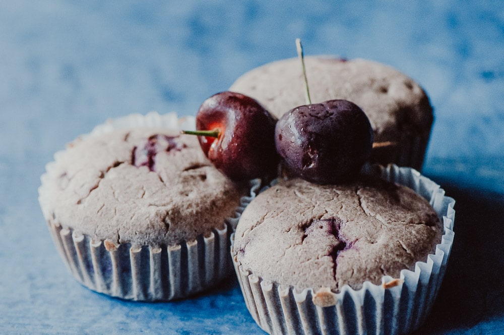   These fluffy Gluten-Free Cherry Muffins have a soft, spongy and juicy cherry cobbler center! Made with a blend of buckwheat flour and tapioca flour, these delightful muffins are super quick and easy to make and filled with pleasing textures and flavors. Gluten-free, vegan, dairy-free, soy-free, nut-free and refined sugar-free. #cherrymuffins #vegancherryrecipes #glutenfreecherrymuffins #buckwheatmuffins #cherrycobbler  