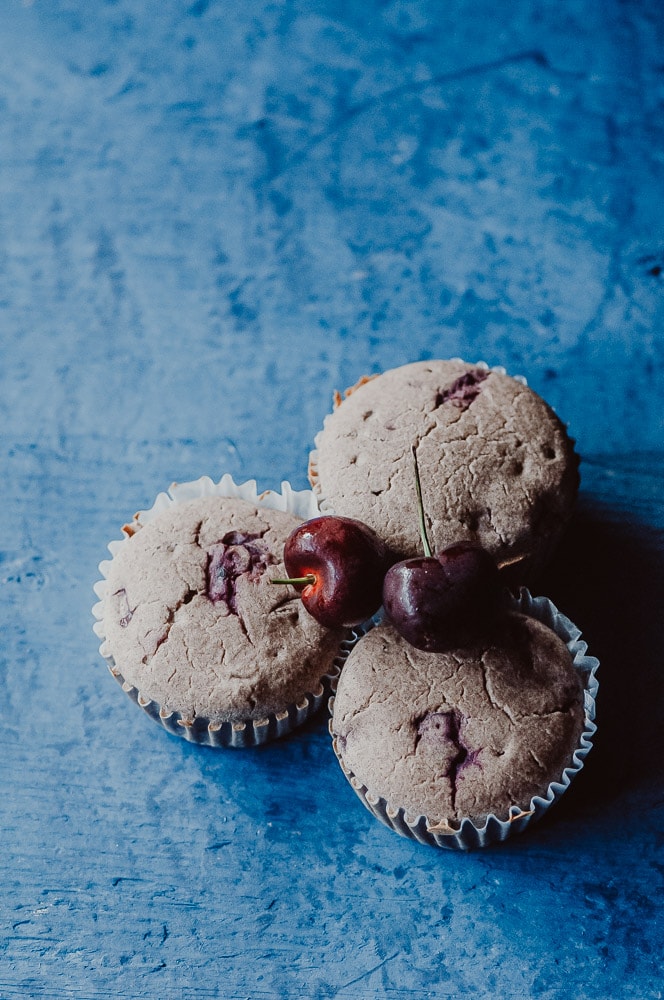   These fluffy Gluten-Free Cherry Muffins have a soft, spongy and juicy cherry cobbler center! Made with a blend of buckwheat flour and tapioca flour, these delightful muffins are super quick and easy to make and filled with pleasing textures and flavors. Gluten-free, vegan, dairy-free, soy-free, nut-free and refined sugar-free. #cherrymuffins #vegancherryrecipes #glutenfreecherrymuffins #buckwheatmuffins #cherrycobbler  