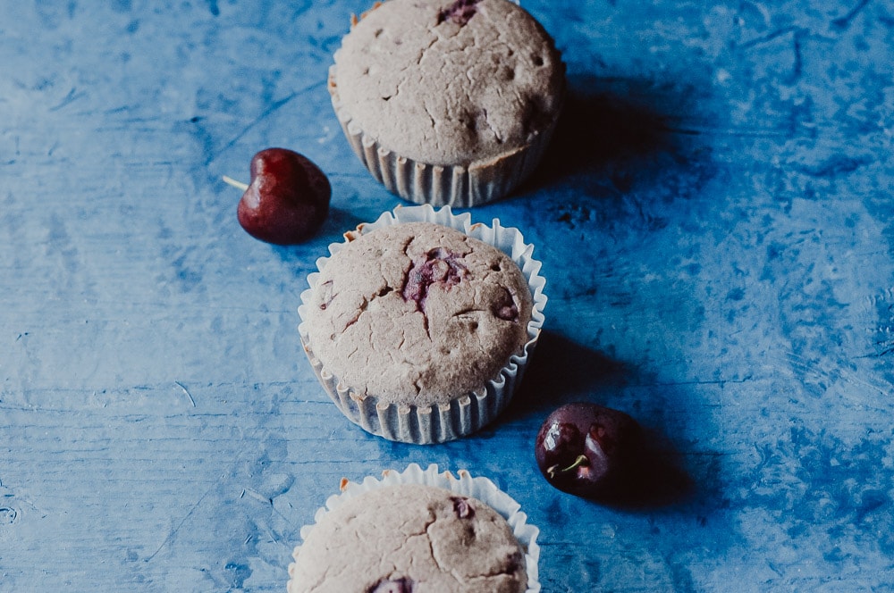   These fluffy Gluten-Free Cherry Muffins have a soft, spongy and juicy cherry cobbler center! Made with a blend of buckwheat flour and tapioca flour, these delightful muffins are super quick and easy to make and filled with pleasing textures and flavors. Gluten-free, vegan, dairy-free, soy-free, nut-free and refined sugar-free. #cherrymuffins #vegancherryrecipes #glutenfreecherrymuffins #buckwheatmuffins #cherrycobbler  