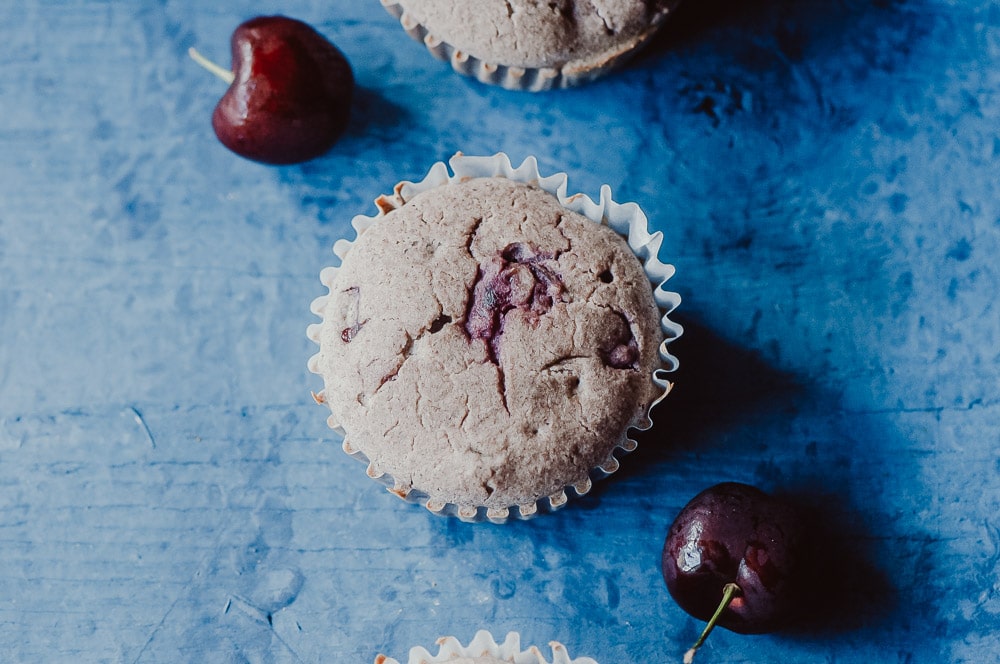   These fluffy Gluten-Free Cherry Muffins have a soft, spongy and juicy cherry cobbler center! Made with a blend of buckwheat flour and tapioca flour, these delightful muffins are super quick and easy to make and filled with pleasing textures and flavors. Gluten-free, vegan, dairy-free, soy-free, nut-free and refined sugar-free. #cherrymuffins #vegancherryrecipes #glutenfreecherrymuffins #buckwheatmuffins #cherrycobbler  