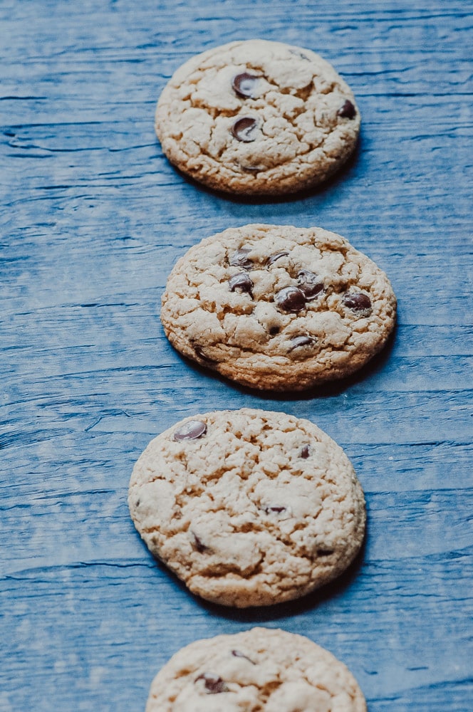  The BEST easy and healthy Vegan + Gluten-Free Chocolate Chip Cookies! These chewy cookies with crisp edges are made with homemade seed flour for an amazing texture, flavor and added nutritional powder! You only need one bowl to make them, too! #glutenfreechocolatechipcookies #veganchocolatechipcookies #glutenfreevegancookies #glutenfreeveganchocolatechipcookies #seedflourcookies #healthychocolatechipcookies 