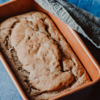 banana bread in a copper loaf pan