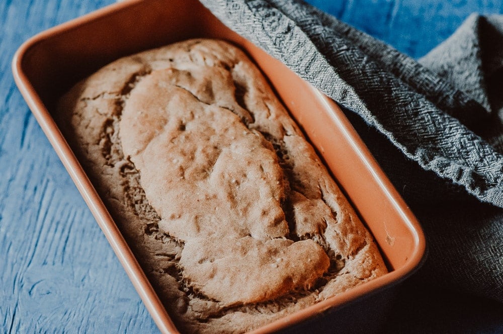 banana bread in a copper loaf pan