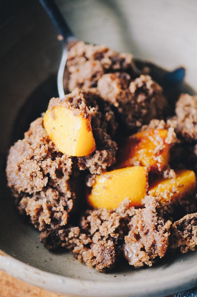   This easy and healthy gluten-free peach cobbler recipe is made with a blend of buckwheat and tapioca flours for a lovely flavor and texture that greatly complements juicy peaches for a heart-warming breakfast or dessert! Refined sugar-free with a dairy-free + vegan option! #glutenfreecobbler #glutenfreepeachcobbler #veganpeachcobbler #healthypeachcobbler  