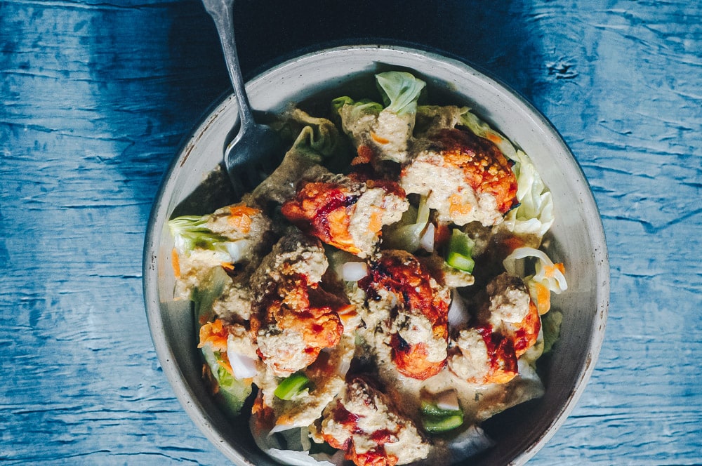   This delicious Roasted Cauliflower Salad makes for one healthy, easy, delicious and filling dish topped with a delightful Sweet and Spicy BBQ Roasted Cauliflower packed with loads of flavor and spice. Contrasted with fresh, crisp iceberg lettuce, and my pumpkin seed vegan ranch dressing, this vegan salad is a medley of pleasing textures, too! #roastedcauliflowersalad #bbqcauliflowersalad #cauliflowerwingsalad  