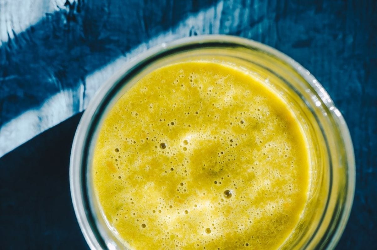 fermented hot sauce close up yellow sauce in jar