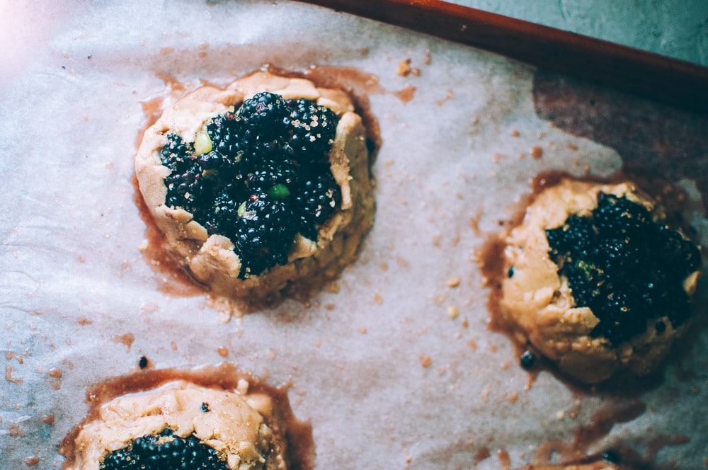  How-to make Mini Blackberry Kiwi Galettes step by step process shots -  These gluten-free vegan mini rustic pies are filled with juicy blackberries and tart kiwi for a fun twist! Easy, healthy, and delicious galettes are at your fingertips! #galette #galettes #minipies #rusticepies #kiwi #blackberries #glutenfreepie #veganpie #kiwipie  