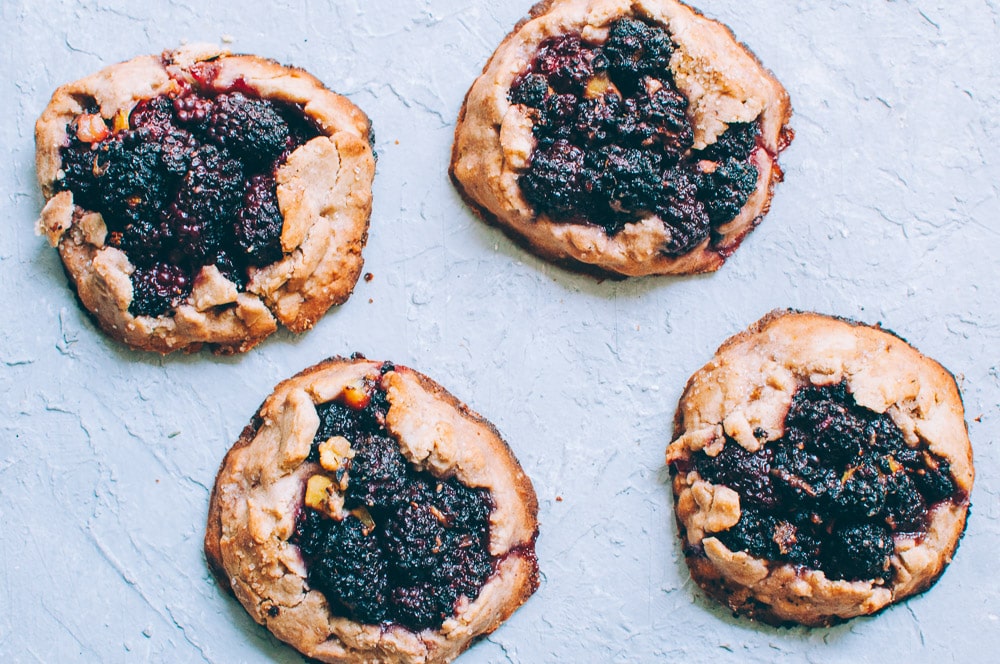  How-to make Mini Blackberry Kiwi Galettes step by step process shots -  These gluten-free vegan mini rustic pies are filled with juicy blackberries and tart kiwi for a fun twist! Easy, healthy, and delicious galettes are at your fingertips! #galette #galettes #minipies #rusticepies #kiwi #blackberries #glutenfreepie #veganpie #kiwipie  