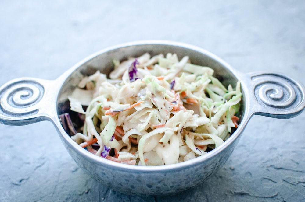  Creamy Vegan Coleslaw Recipe -  This creamy vegan take on a classic coleslaw salad recipe is rich, creamy, refreshing, crunchy, healthy and bursting with big flavor! This easy vegan coleslaw is perfect as is, or served in addition to your favorite summer meals. #vegancoleslaw #dairyfreecoleslaw  