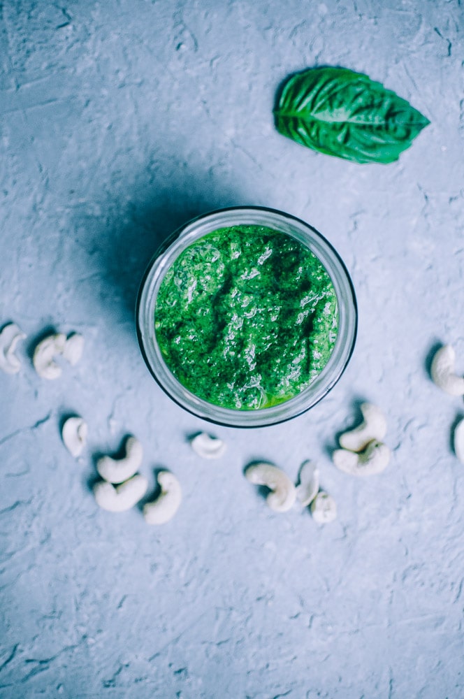  Easy Vegan Cashew Pesto Recipe -  This Vegan Basil Cashew Pesto recipe could not be tastier! Made with just a handful of simple, healthy ingredients, this creamy vegan pesto makes a vibrant accompaniment to variety of foods and dishes! #veganpesto #veganpestorecipe #easyveganpesto #cashewpesto #basilcashewpesto #vegancashewpesto  
